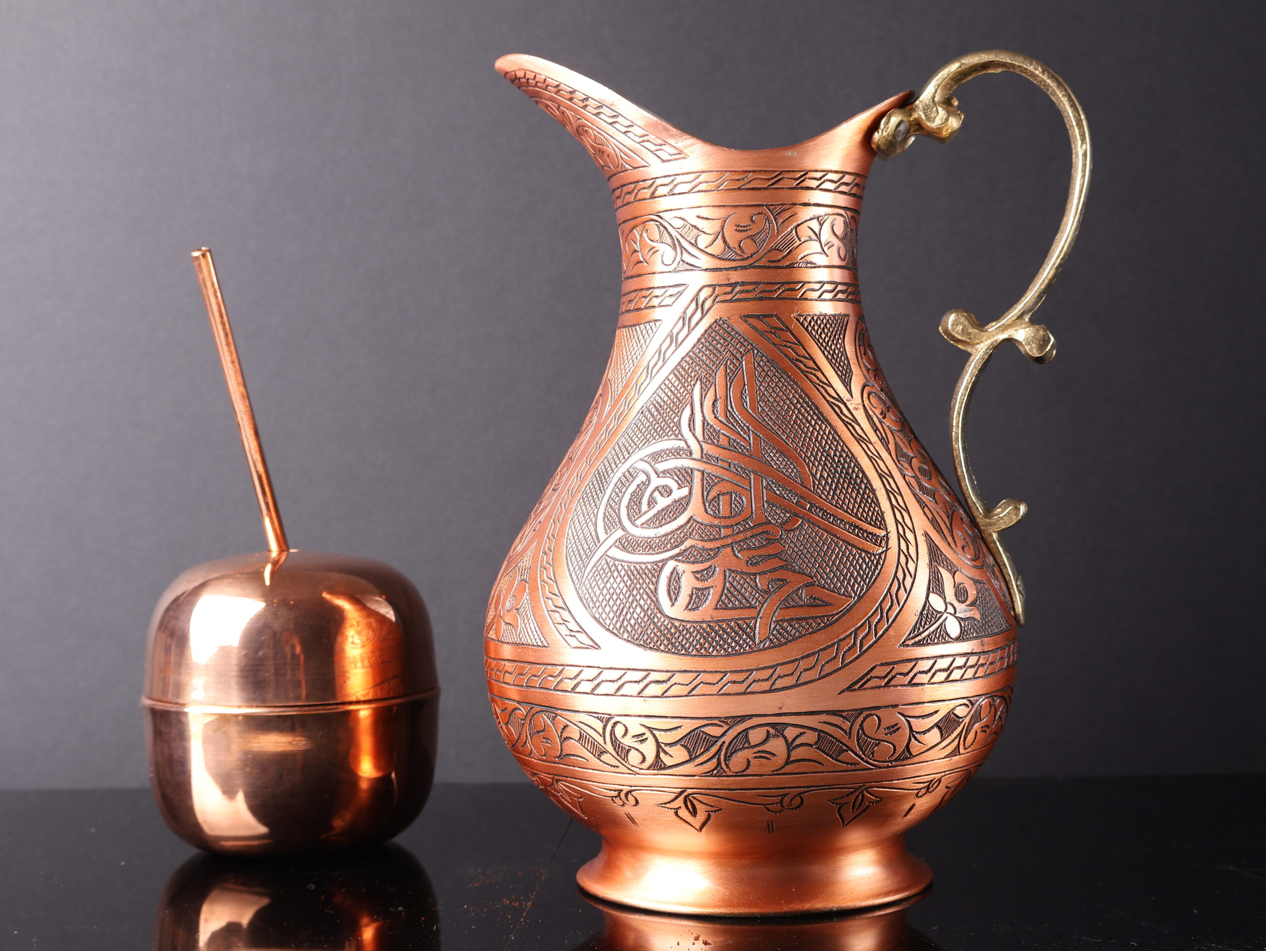 Handmade copper water jug with 2L capacity.